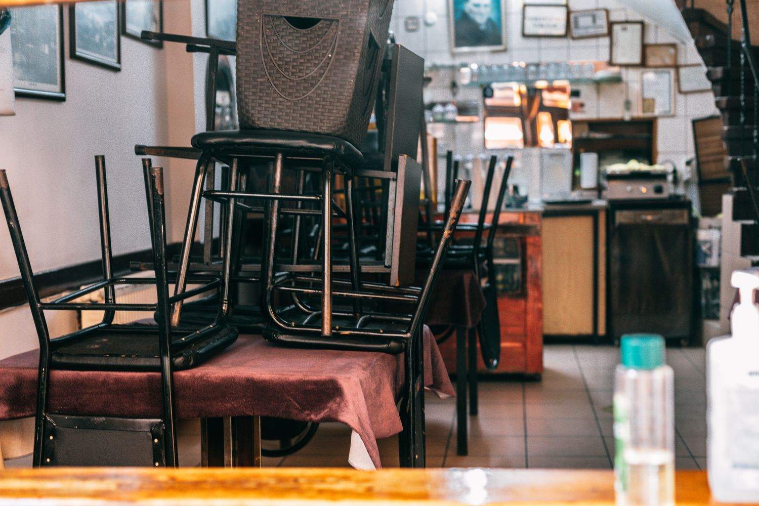 A quiet restaurant with chairs up on the tables