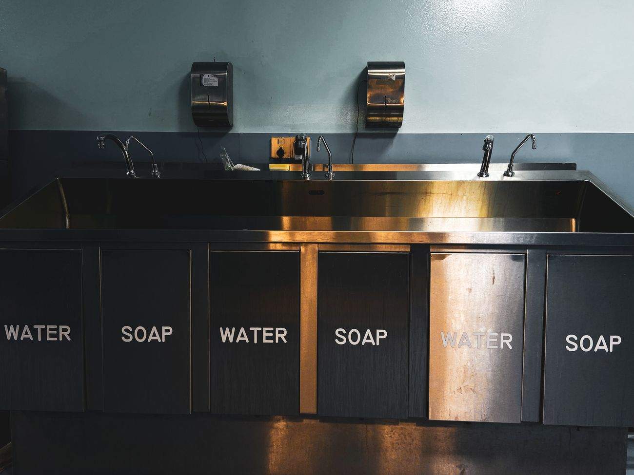 A stainless steel compartment sink